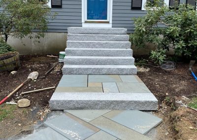 new granite steps with angled bluestone