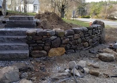 another angle of fieldstone wall complete