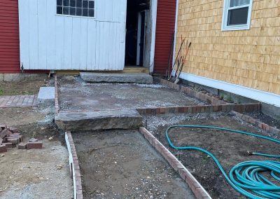 forms placed with brick edging for patio and walkway